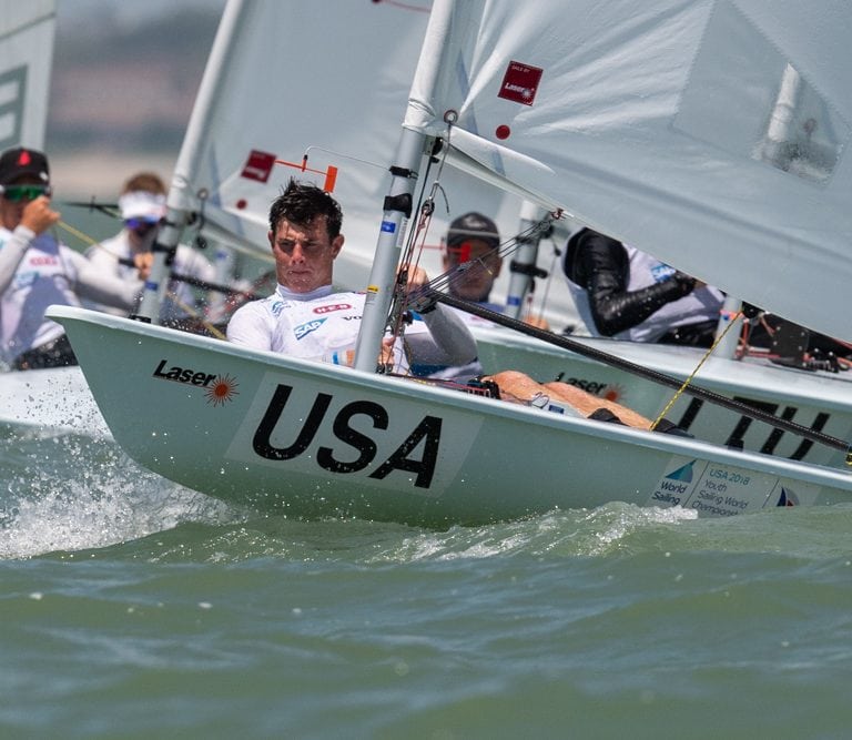 Chase Carraway hikes off the start line during racing in the Boys' Laser Radial Class at the 48th Youth World Championship in Corpus Christi, Texas (Jen Edney/World Sailing photo).
