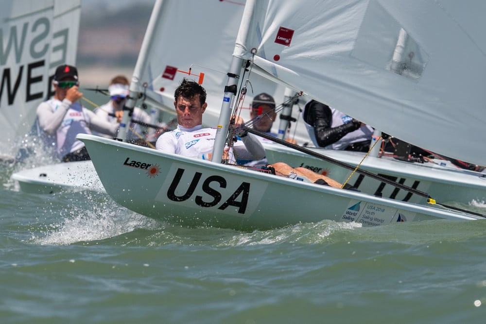 Chase Carraway hikes off the start line during racing in the Boys' Laser Radial Class at the 48th Youth World Championship in Corpus Christi, Texas (Jen Edney/World Sailing photo).
