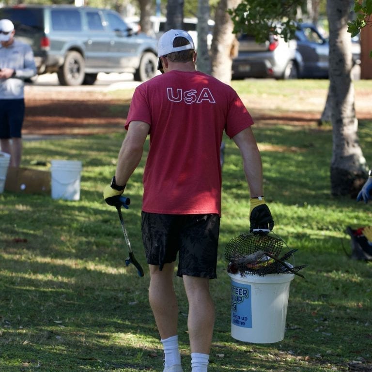 US Sailing Athlete participating in coastal cleanup